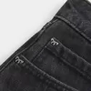 Mini gonna-pantalone in denim nero lavato a vita bassa