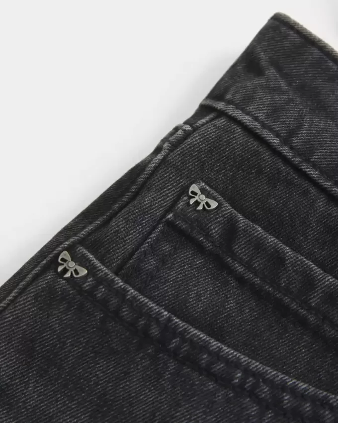 Mini gonna-pantalone in denim nero lavato a vita bassa