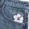 Mini gonna-pantalone in denim ricamato a vita bassa