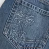 Mini gonna-pantalone in denim ricamato a vita bassa