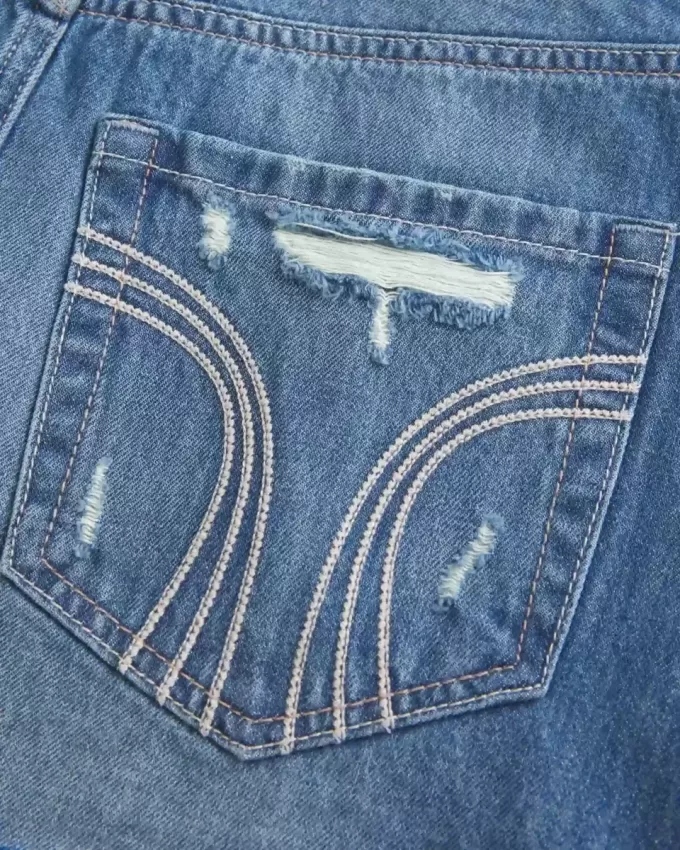 Mini gonna-pantalone in denim scuro strappato a vita bassa Mini gonna-pantalone in denim scuro strappato a vita bassa