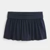Mini gonna-pantalone in maglia con risvolto