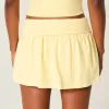 Mini gonna-pantalone in maglia con risvolto