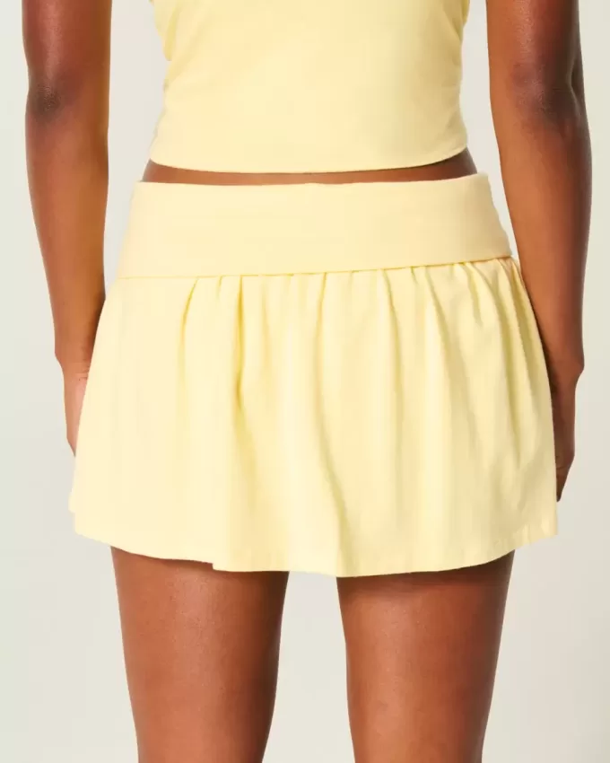 Mini gonna-pantalone in maglia con risvolto