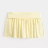 Mini gonna-pantalone in maglia con risvolto