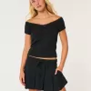 Mini gonna-pantalone plissettata a vita media