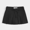 Mini gonna-pantalone plissettata a vita media