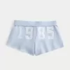 Mini pantaloncini in pile con grafica in pizzo Mini pantaloncini in pile con grafica in pizzo
