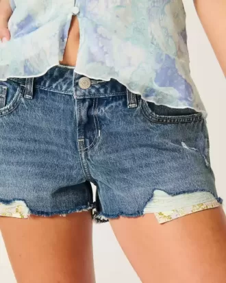 Mini shorts in denim a vita bassa effetto used lavaggio medio