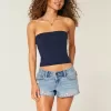 Mini shorts in denim ricamati a vita bassissima Mini shorts in denim ricamati a vita bassissima