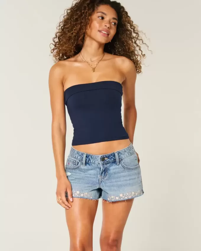 Mini shorts in denim ricamati a vita bassissima Mini shorts in denim ricamati a vita bassissima
