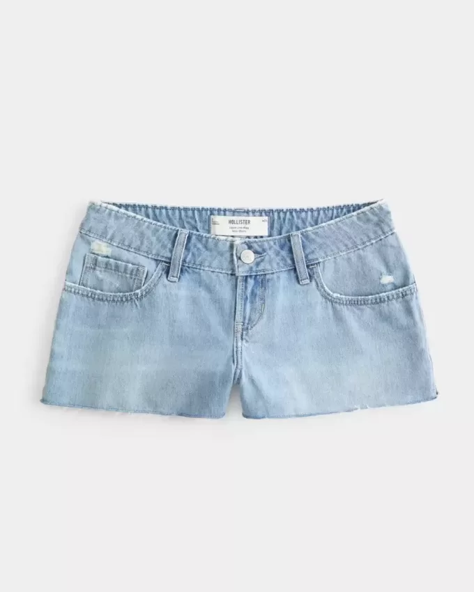 Mini shorts in denim strappati a vita bassa e lavaggio medio Mini shorts in denim strappati a vita bassa e lavaggio medio