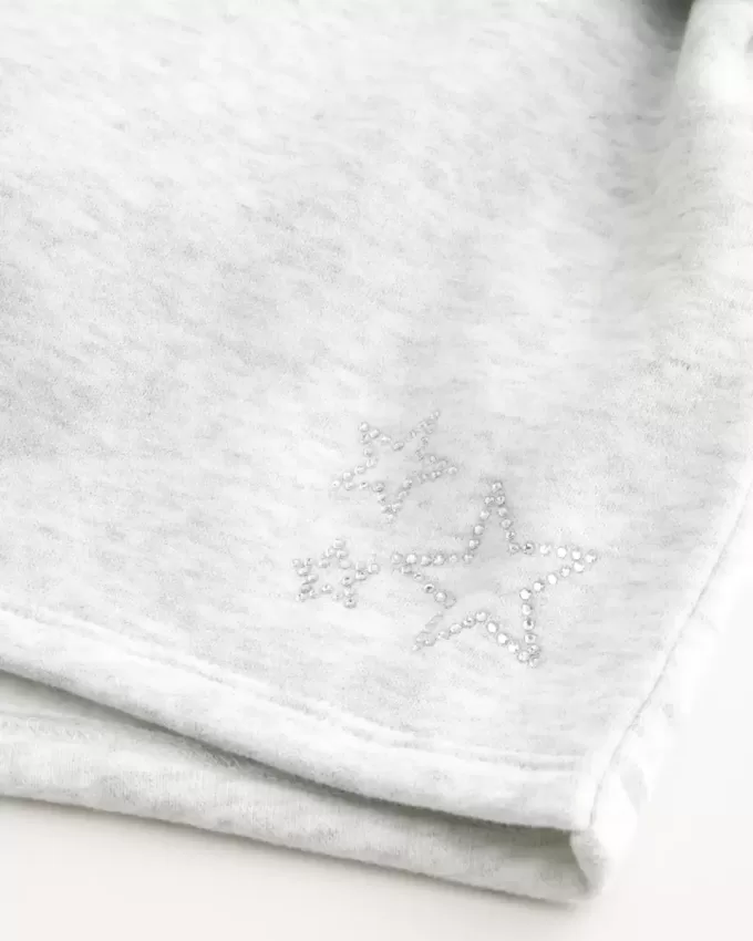Mini shorts in pile con grafica a stella Mini shorts in pile con grafica a stella