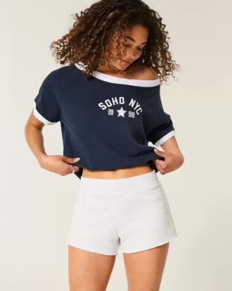 Mini shorts in pile con strisce laterali
