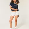 Mini shorts in pile con strisce laterali