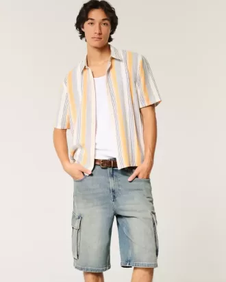 Pantaloncini cargo in denim super larghi con lavaggio medio
