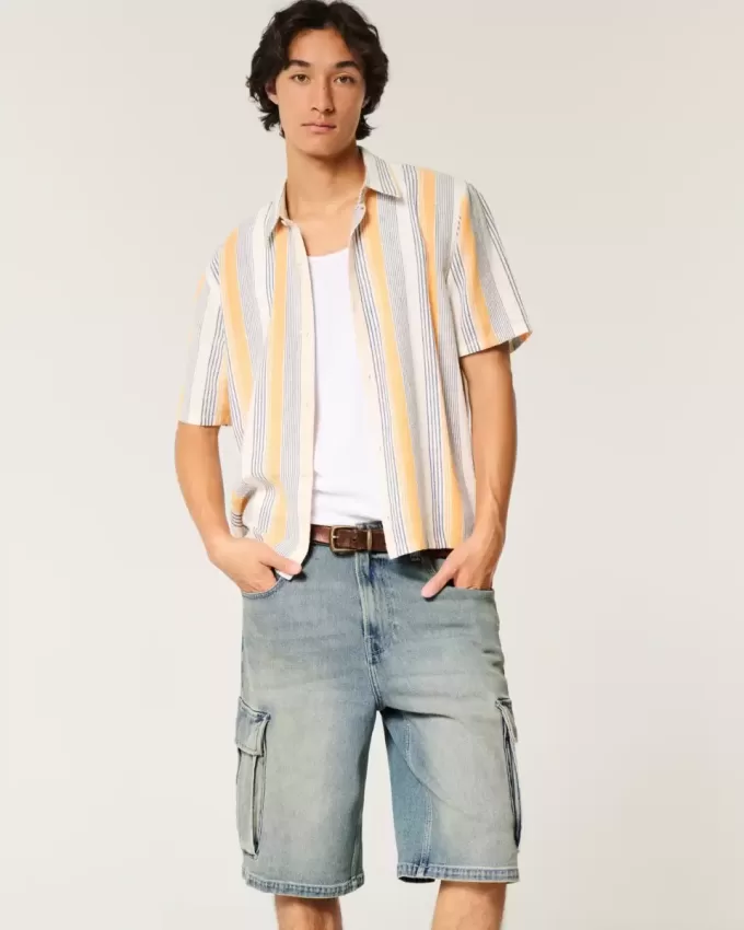 Pantaloncini cargo in denim super larghi con lavaggio medio