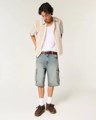 Pantaloncini cargo in denim super larghi con lavaggio medio