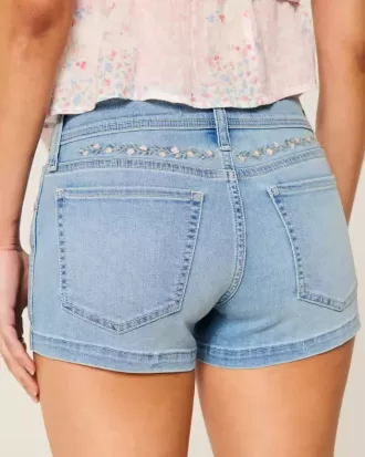 Pantaloncini corti in denim a vita bassa con ricamo floreale e lavaggio chiaro