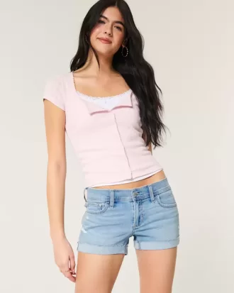 Pantaloncini corti in denim chiaro strappato a vita bassa