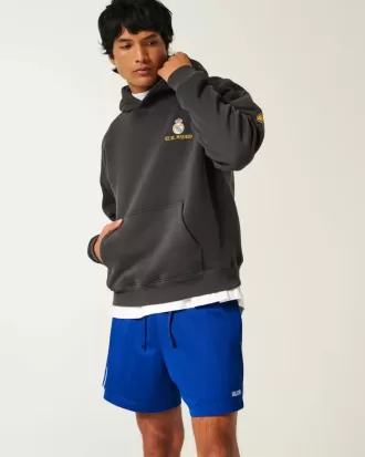 Pantaloncini da calcio con logo in maglia a metà coscia