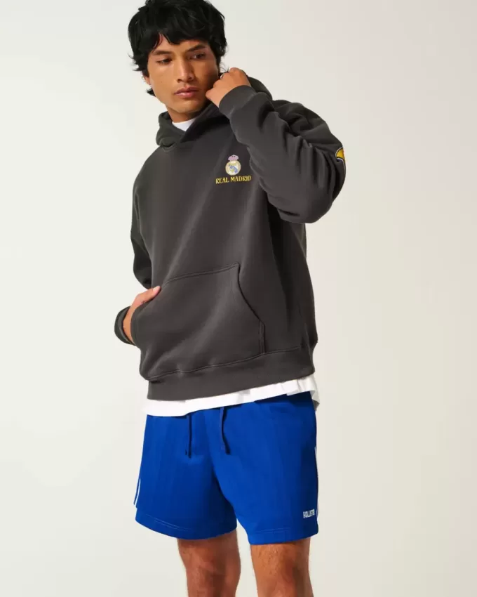 Pantaloncini da calcio con logo in maglia a metà coscia