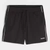 Pantaloncini da calcio con logo in maglia a metà coscia