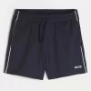 Pantaloncini da calcio con logo in maglia a metà coscia