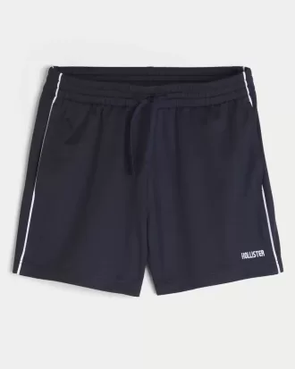 Pantaloncini da calcio con logo in maglia a metà coscia