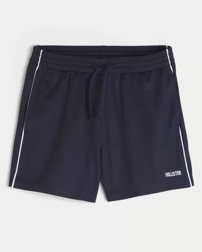 Pantaloncini da calcio con logo in maglia a metà coscia