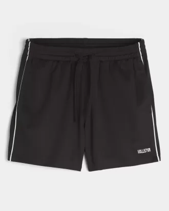 Pantaloncini da calcio con logo in maglia a metà coscia