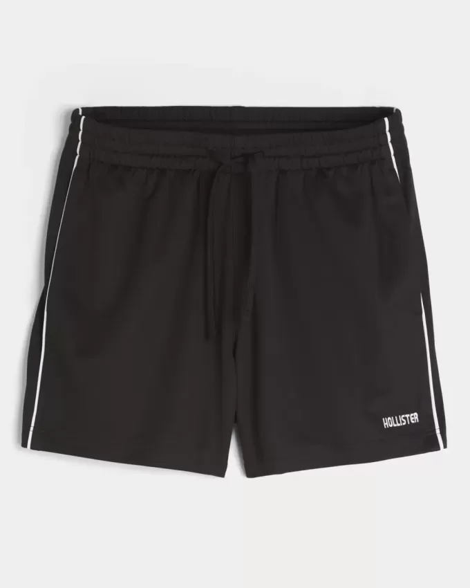 Pantaloncini da calcio con logo in maglia a metà coscia