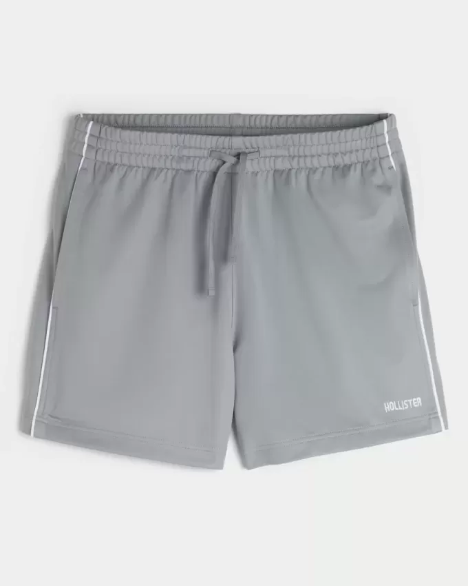 Pantaloncini da calcio con logo in maglia a metà coscia