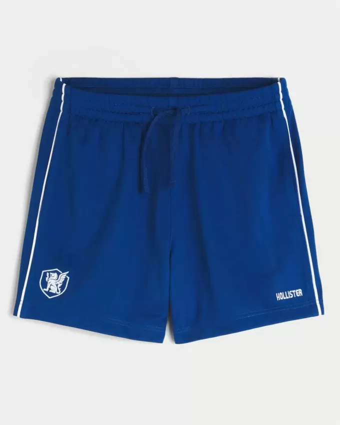 Pantaloncini da calcio con logo in maglia a metà coscia