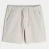 Pantaloncini da tennis sopra il ginocchio