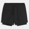 Pantaloncini ibridi attivi a metà coscia