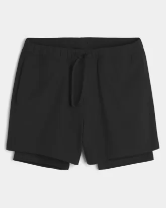 Pantaloncini ibridi attivi a metà coscia