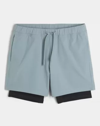 Pantaloncini ibridi attivi a metà coscia
