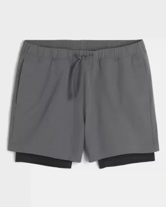 Pantaloncini ibridi attivi a metà coscia