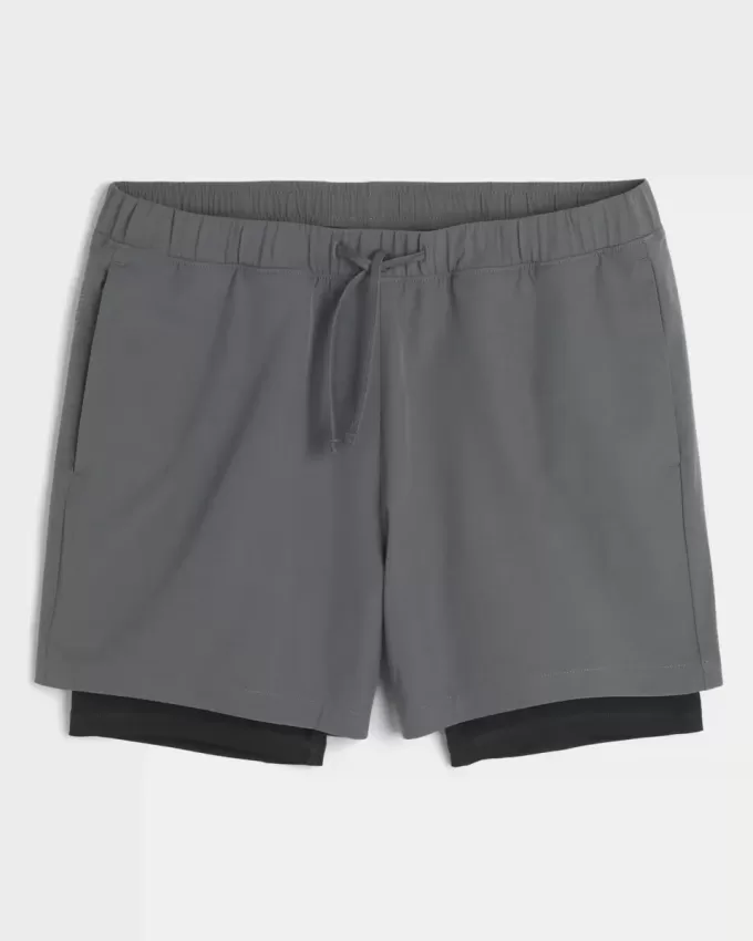 Pantaloncini ibridi attivi a metà coscia