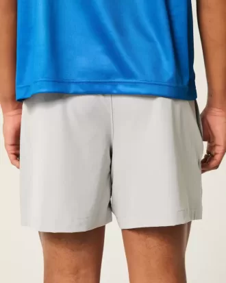 Pantaloncini ibridi attivi a metà coscia