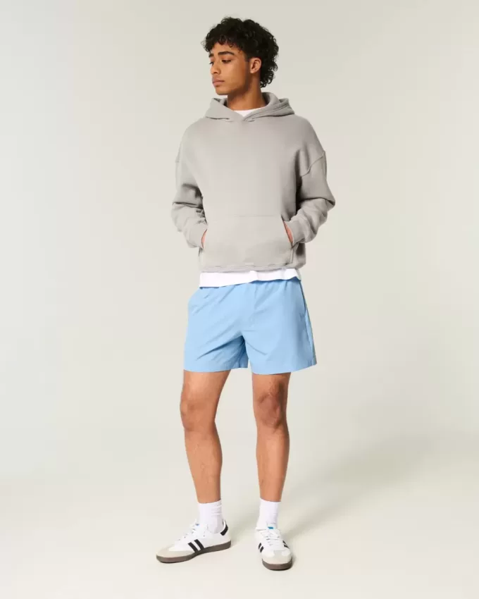 Pantaloncini ibridi attivi a metà coscia