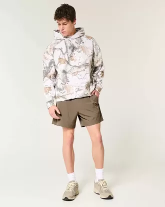 Pantaloncini ibridi attivi a metà coscia