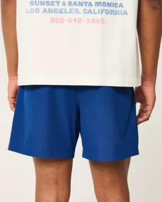 Pantaloncini ibridi attivi a metà coscia
