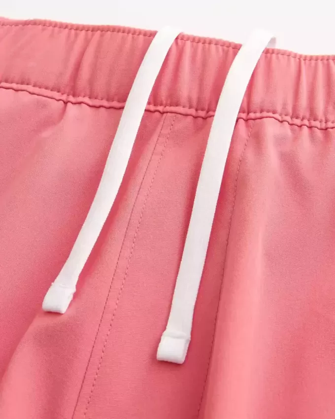 Pantaloncini ibridi attivi a metà coscia