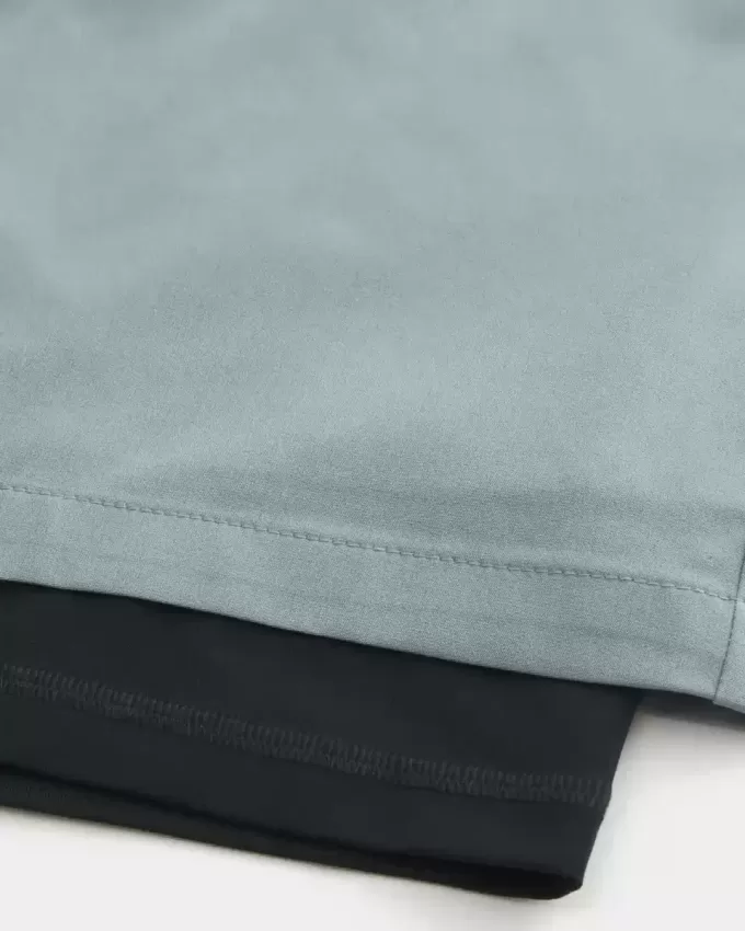 Pantaloncini ibridi attivi a metà coscia