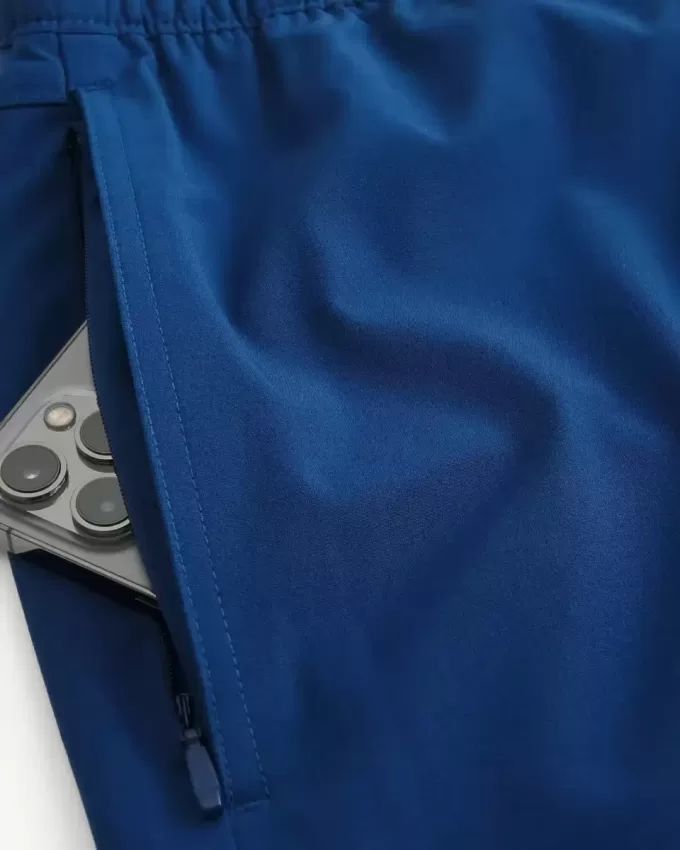Pantaloncini ibridi attivi a metà coscia