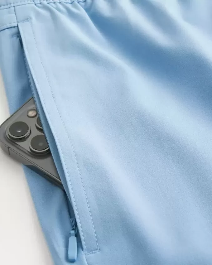 Pantaloncini ibridi attivi a metà coscia