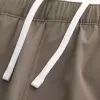 Pantaloncini ibridi attivi a metà coscia