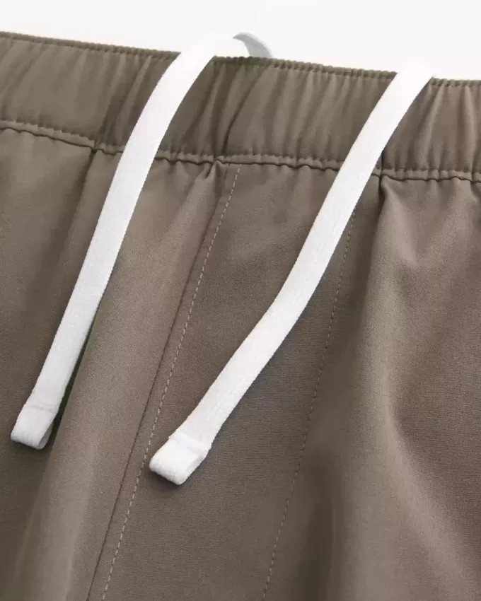 Pantaloncini ibridi attivi a metà coscia
